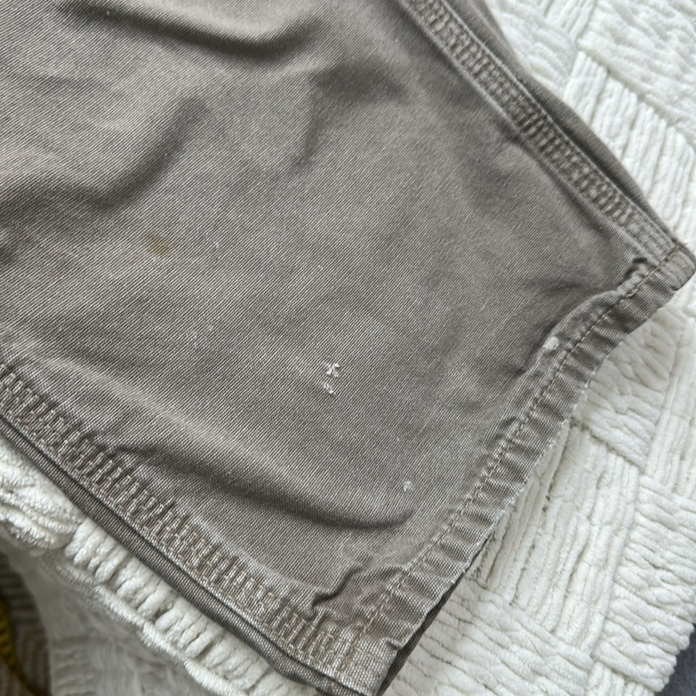 Carhartt distressed carpenter pants with some stains and holes. #10015 - Picture 4 of 11